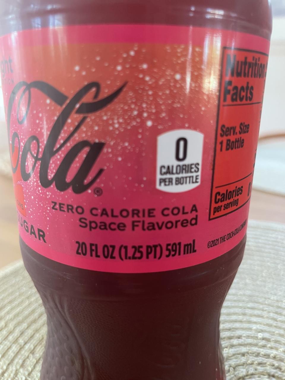 A close-up of the label, which says, "Zero calorie cola, space flavored"