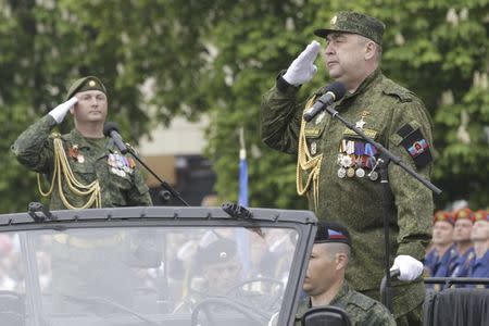 FILE PHOTO: Igor Plotnitsky (R), leader of the self-proclaimed Lugansk People's Republic, salutes during the Victory Day military parade in the rebel-held city of Luhansk, Ukraine May 9, 2017. REUTERS/Alexander Ermochenko/File Photo