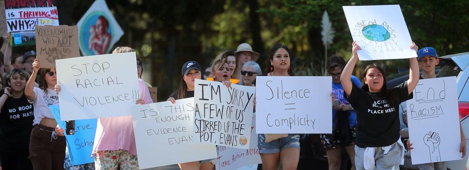 The Eliminate Racial Violence march arrives to the parking lot of the North Kitsap School District building in Poulsbo on Thursday, May 18, 2023.