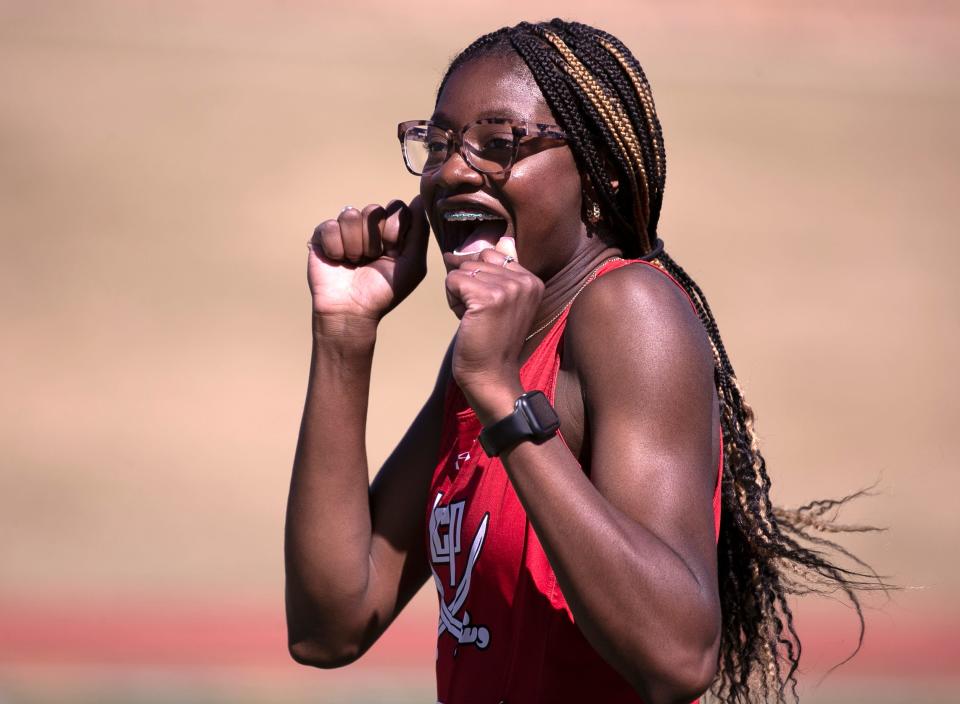 Lubbock-Cooper's Niomi Wines celebrates her 200 meter dash win during the Region I-5A track and field meet, Saturday, April 29, 2023, at Lowrey Field.