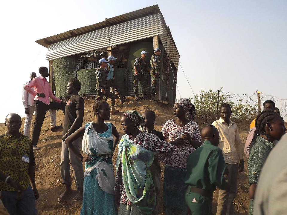 People arrive to seek refuge in the UNMISS compound in Juba, on December 18, 2013. (STR/AFP/Getty Images)