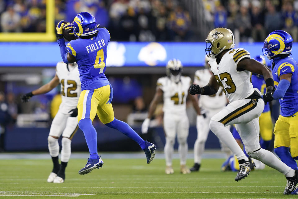 Los Angeles Rams safety Jordan Fuller (4) intercepts a pass during the second half of an NFL football game against the New Orleans Saints, Thursday, Dec. 21, 2023, in Inglewood, Calif. (AP Photo/Ryan Sun)