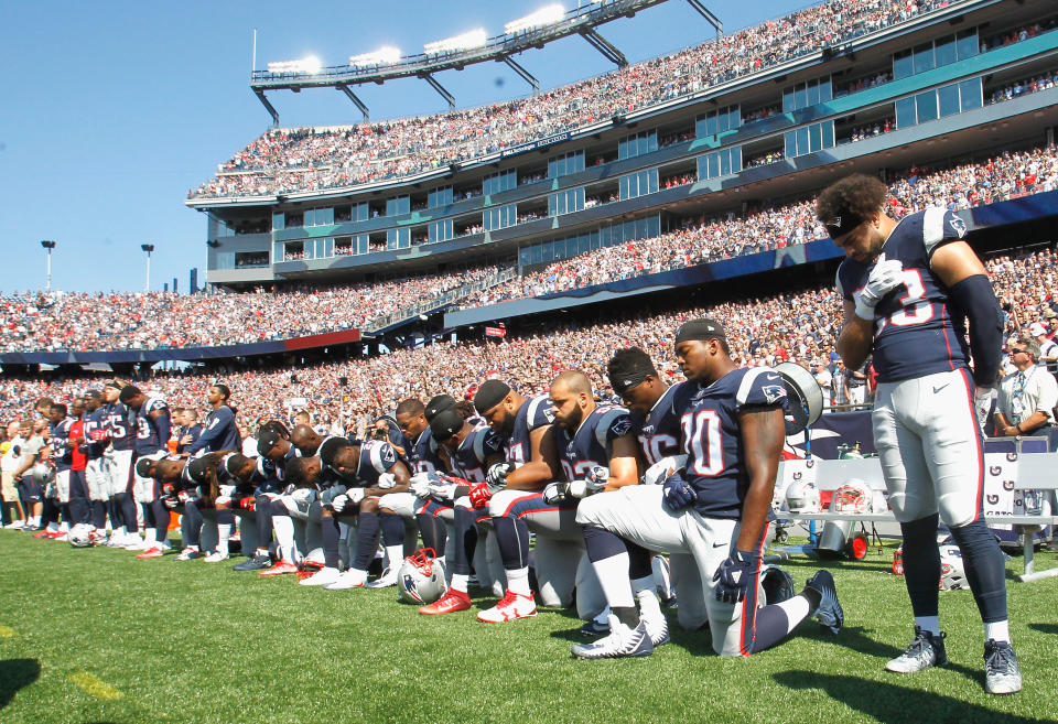 Members of the New England Patriots kneel during the National Anthem before a game against the Houston Texans at Gillette Stadium on September 24, 2017 in Foxboro, Massachusetts. (Photo by Jim Rogash/Getty Images)