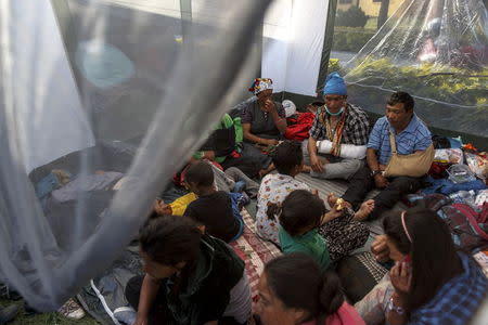 Earthquake survivors from Kyanjin Gumba in Langtang valley near Nepal's border with Tibet, gather inside their makeshift shelter at Yellow Gompa in Kathmandu, Nepal, May 5, 2015. REUTERS/Athit Perawongmetha