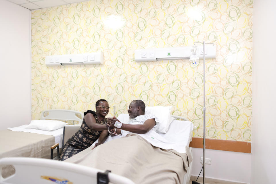 A couple holding hands in the hospital