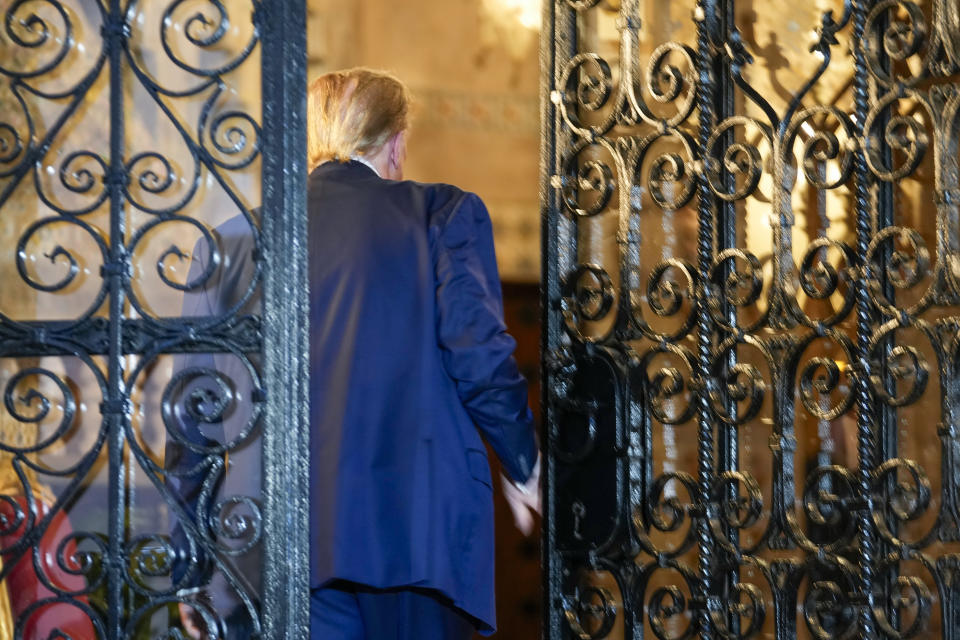 Republican presidential candidate former President Donald Trump walks back inside after speaking at his Mar-a-Lago estate, Friday, Feb. 16, 2024, in Palm Beach, Fla. (AP Photo/Rebecca Blackwell)