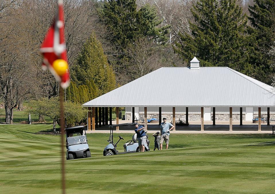 Golfers approach a shot on hole No. 1 at the Ashland Golf Club in April. TOM E. PUSKAR/ASHLAND TIMES-GAZETTE