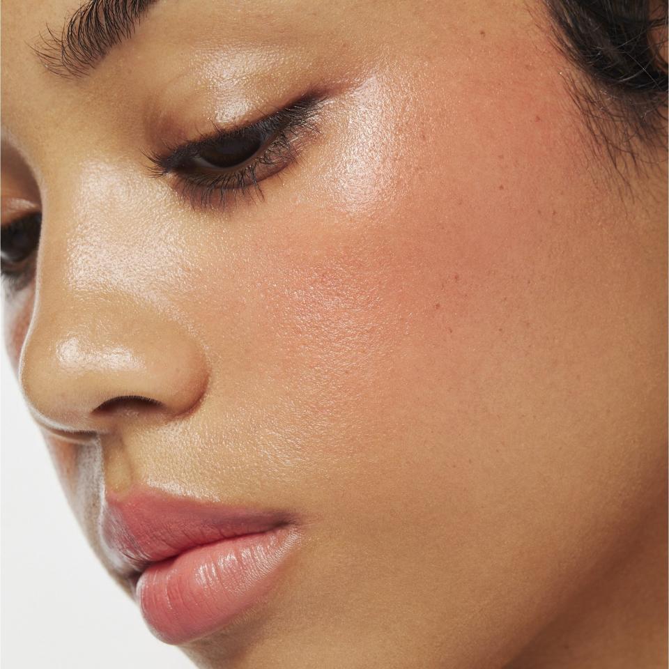 Model wearing a pink tint on their cheek