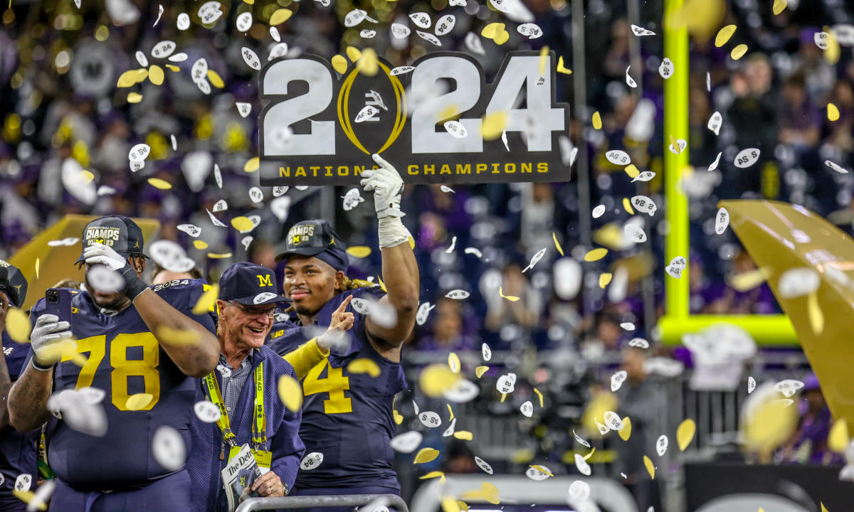 LOOK Michigan football hangs new banners in Al Glick Field House