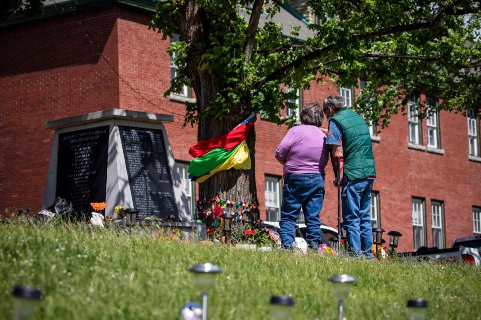 A memorial outside the former Kamloops Indian Residential School at a growing memorial to honour the 215 children whose remains have been discovered buried in Kamloops, British Columbia on Friday June 4, 2021.