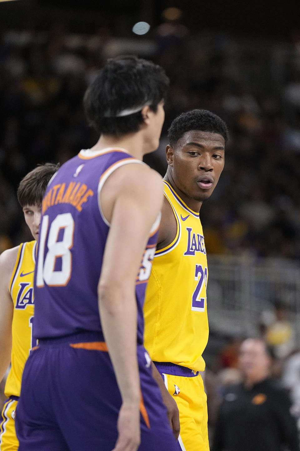 Los Angeles Lakers forward Rui Hachimura, right, stands on the court with Phoenix Suns forward Yuta Watanabe during the first half of an NBA preseason basketball game Thursday, Oct. 19, 2023, in Thousand Palms, Calif. (AP Photo/Mark J. Terrill)
