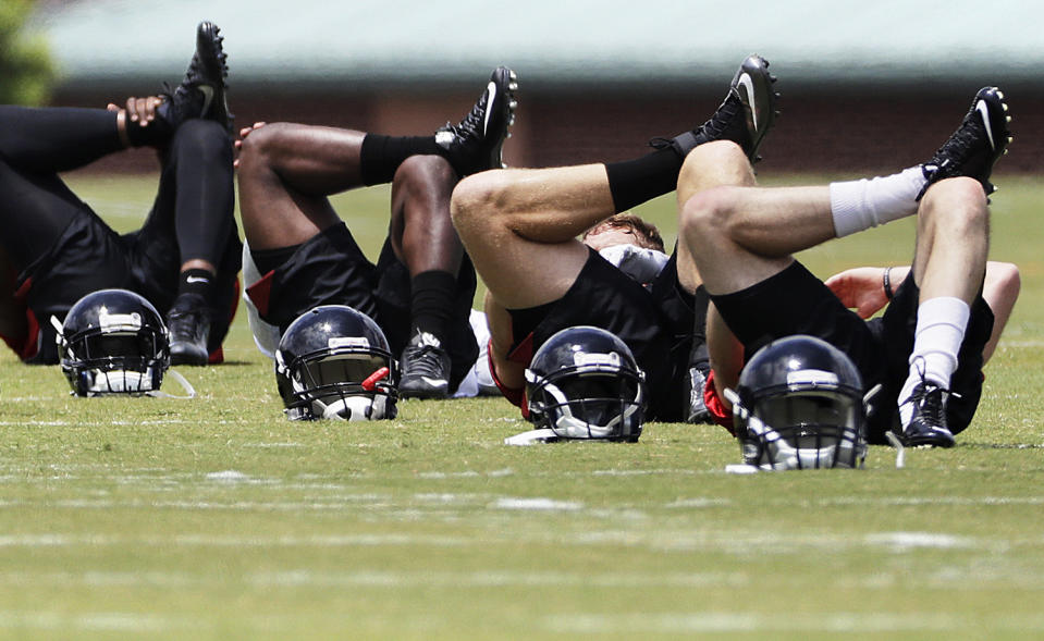 <p>Atlanta Falcons players stretch during the team’s NFL football rookie minicamp in Flowery Branch, Ga., May 12, 2017. (Photo: David Goldman/AP) </p>