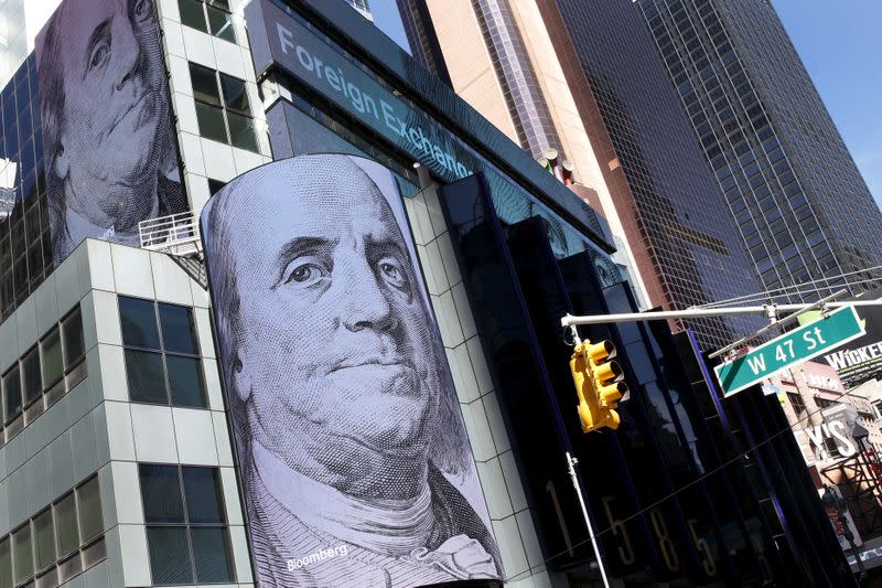 FILE PHOTO: Images and market data are displayed on new digital display signs on the exterior of the headquarters of Morgan Stanley at 1585 Broadway in New York