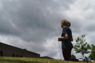 FILE - Anna Kelley recites the Rosary while praying outside a Planned Parenthood clinic as patients arrive for abortion appointments, May 27, 2022, in Columbia, S.C. Reproductive freedom was not the only demand of second-wave feminism, as the women's movement of the '60s and '70s is known, but it was surely one of the most galvanizing issues, along with workplace equality. (AP Photo/David Goldman, File)