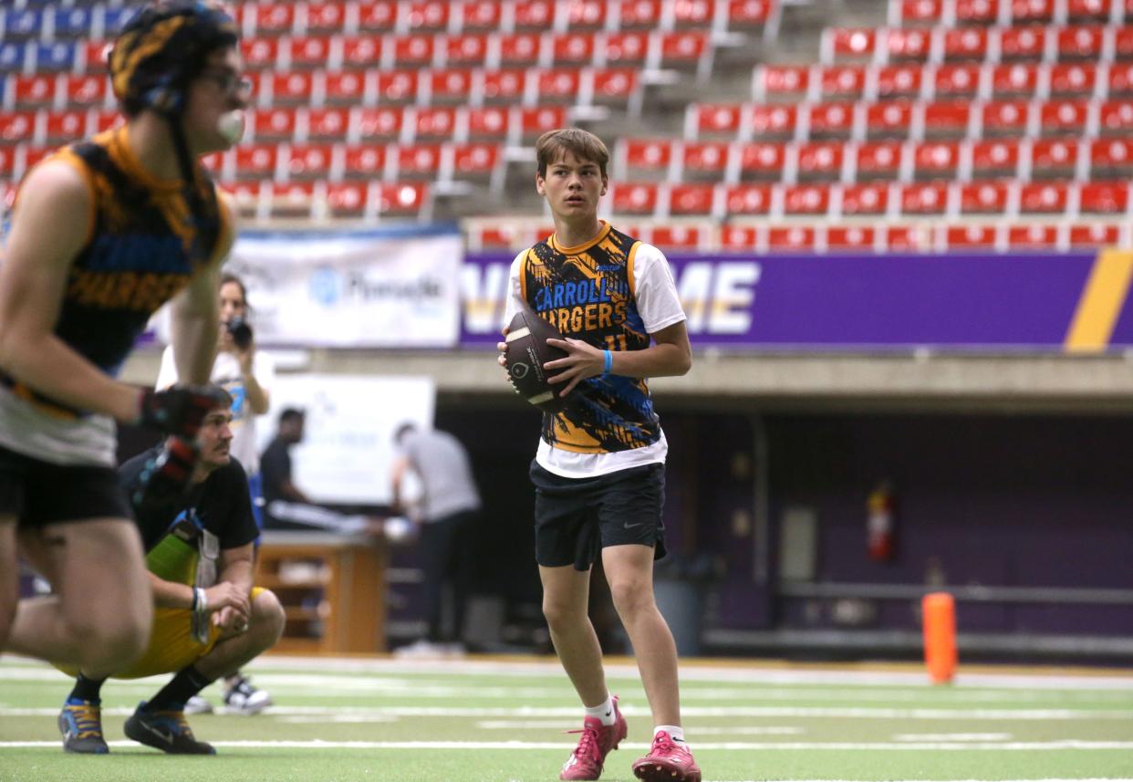 Carroll's Taylen Alford looks to pass during a 7-on-7 football tournament Saturday at the UNI Dome in Cedar Falls.