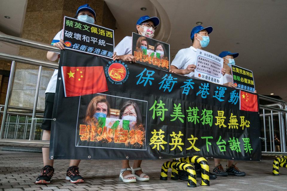 Pro-China supporters protest against U.S. House of Representatives Speaker Nancy Pelosi's visit to Taiwan on August 11, 2022 in Hong Kong, China.