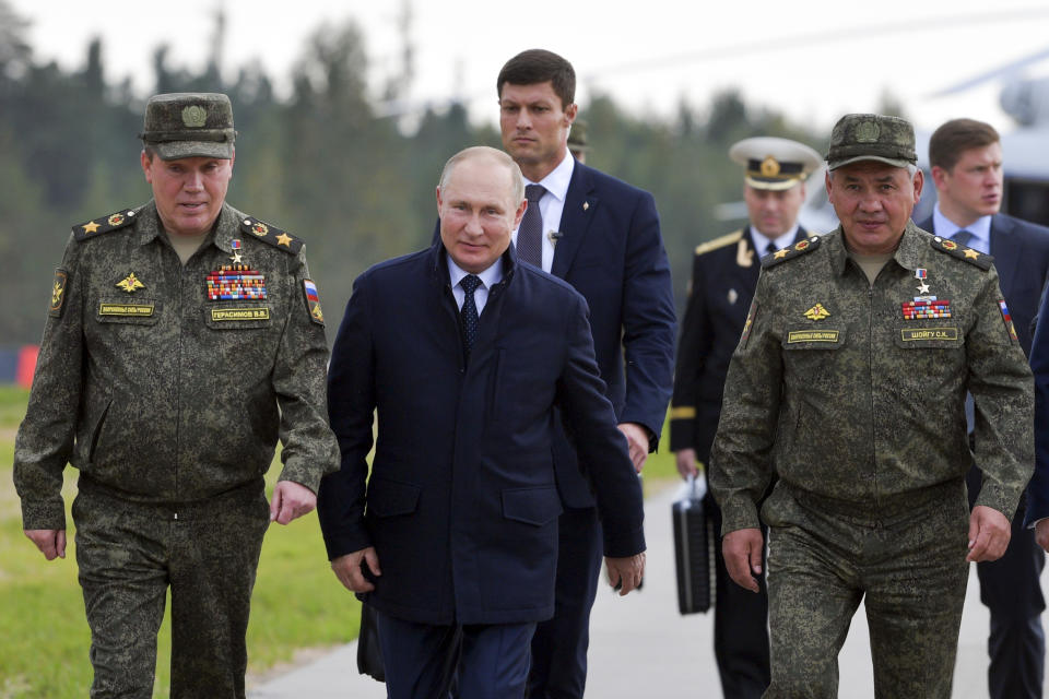 Russian President Vladimir Putin, center, Russian Defense Minister Sergei Shoigu, right, and Russian General Staff Valery Gerasimov, left, walk to attend the joint strategic exercise of the armed forces of the Russian Federation and the Republic of Belarus Zapad-2021 at the Mulino training ground in the Nizhny Novgorod region, Russia, Monday, Sept. 13, 2021. The military drills attend by servicemen of military units and divisions of the Western Military District, representatives of the leadership headquarters and personnel of military contingents of the armed forces of Armenia, Belarus, India, Kazakhstan, Kyrgyzstan and Mongolia. (Sergei Savostyanov, Sputnik, Kremlin Pool Photo via AP)