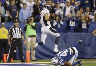 Denver Broncos wide receiver Eric Decker (87) makes a touchdown catch against Indianapolis Colts' Antoine Bethea (41) during the first half of an NFL football game, Sunday, Oct. 20, 2013, in Indianapolis. (AP Photo/Michael Conroy)