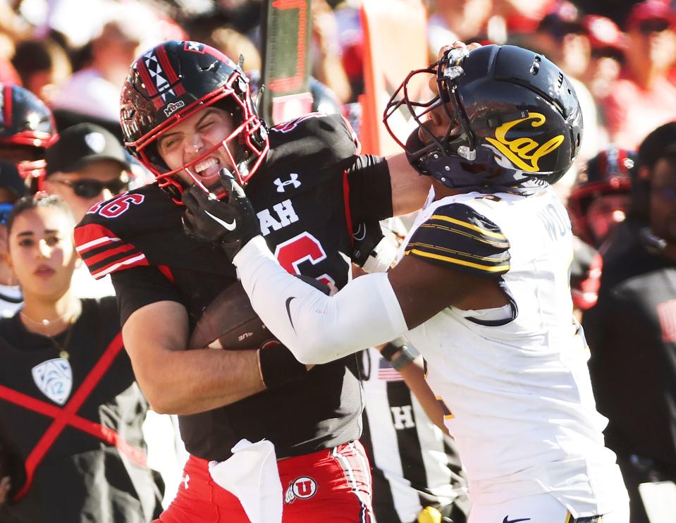 Utah Utes quarterback Bryson Barnes (16) runs for a first down against California Golden Bears defensive back Craig Woodson (2) in Salt Lake City on Saturday, Oct. 14, 2023. Utah won 34-14.