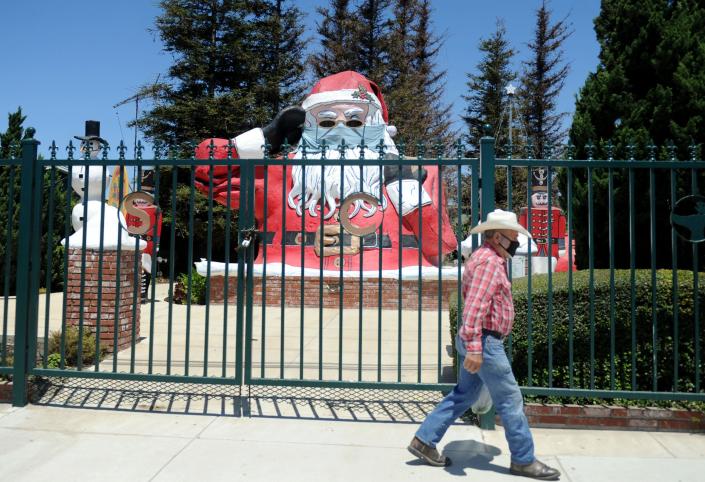 The Nyeland Acres Santa Claus gets his own mask. The 20-foot-tall landmark off Highway 101 north of Oxnard reminds passersby to wear a mask.