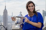 Flavia Pennetta of Italy poses with her Women's U.S. Open Tennis champion trophy at the Top of The Rock in New York, September 13, 2015. Pennetta won her first grand slam singles title over Roberta Vinci in an improbable all-Italian U.S. Open final on Saturday then added one more shock to a stunning fortnight by announcing her retirement. REUTERS/Brendan McDermid