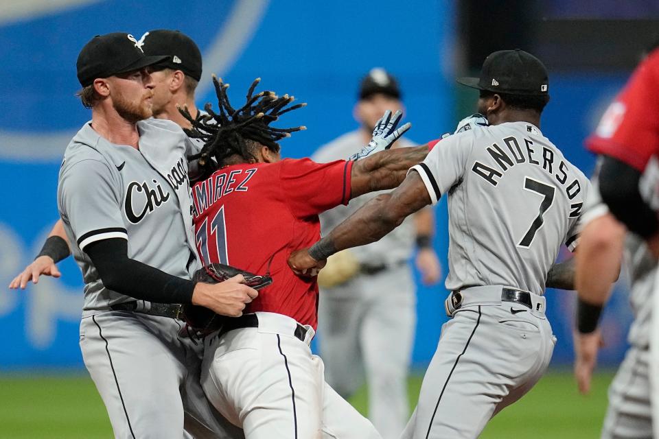 Jose Ramirez, center, lands a punch on Tim Anderson, as the two exchange punches in the sixth inning Saturday.