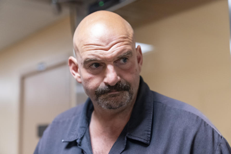 FILE - Sen. John Fetterman, D-Pa., walks to a vote on Capitol Hill, Wednesday, Sept. 6, 2023, in Washington. In a statement on Saturday, Sept. 23, Fetterman became the first Senate Democrat to call for Sen. Robert Menendez to step down after Menendez and his wife were indicted on sweeping corruption charges. (AP Photo/Alex Brandon, File)