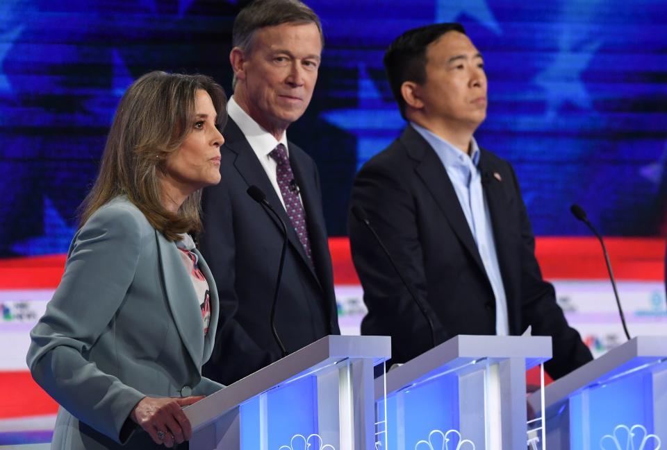 Democratic presidential hopefuls (L-R) US author and writer Marianne Williamson, Former Governor of Colorado John Hickenlooper and US entrepreneur Andrew Yang participate in the second Democratic primary debate of the 2020 presidential campaign season hosted by NBC News at the Adrienne Arsht Center for the Performing Arts in Miami, Florida, June 27, 2019. (Photo by SAUL LOEB / AFP)        (Photo credit should read SAUL LOEB/AFP via Getty Images)