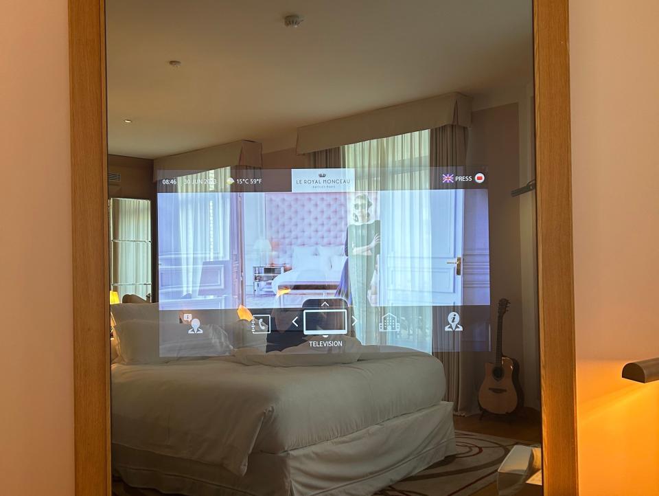 A television in a large mirror at Le Royal Monceau.