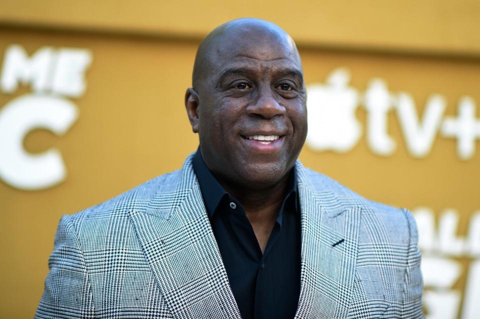 FILE - Magic Johnson arrives at the premiere of 