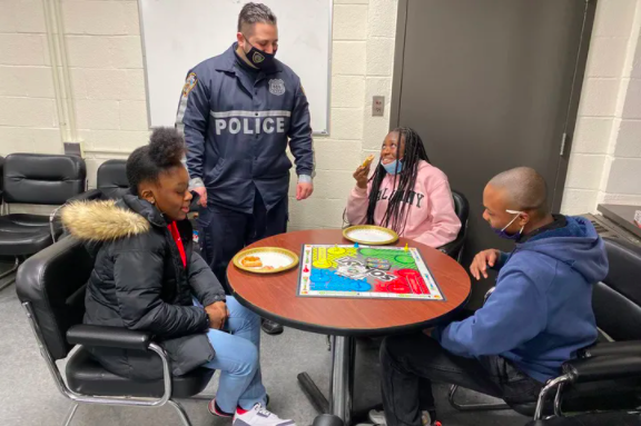 An Youth Coordination Officer talks to neighbors at the 67th Precinct in Brooklyn, Jan. 25. (NYPD 67th Precinct / Twitter)<br>