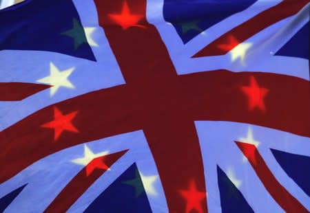 A European Union flag is seen behind a British Union Jack during an anti-brexit protest in London