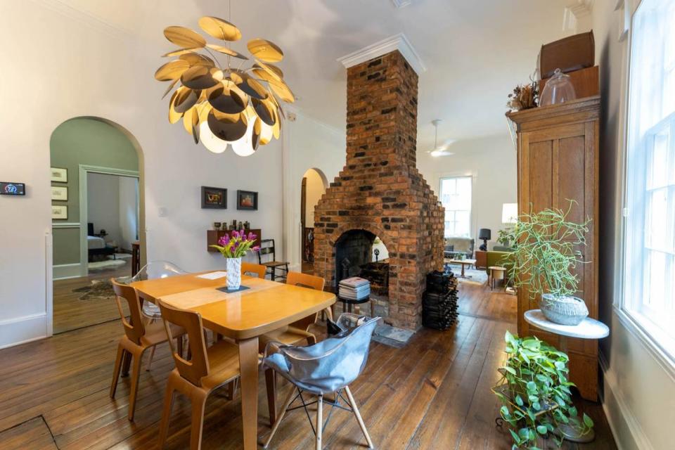 The dining room of the home in Fourth Ward offers a contrast of modern decor against the backdrop of the home built in the 1800s.