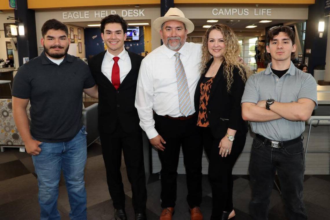 West Hills College Lemoore student body president Aaron Villarreal poses with his family before the May 25, 2023 graduation ceremony at Golden Eagle Arena.