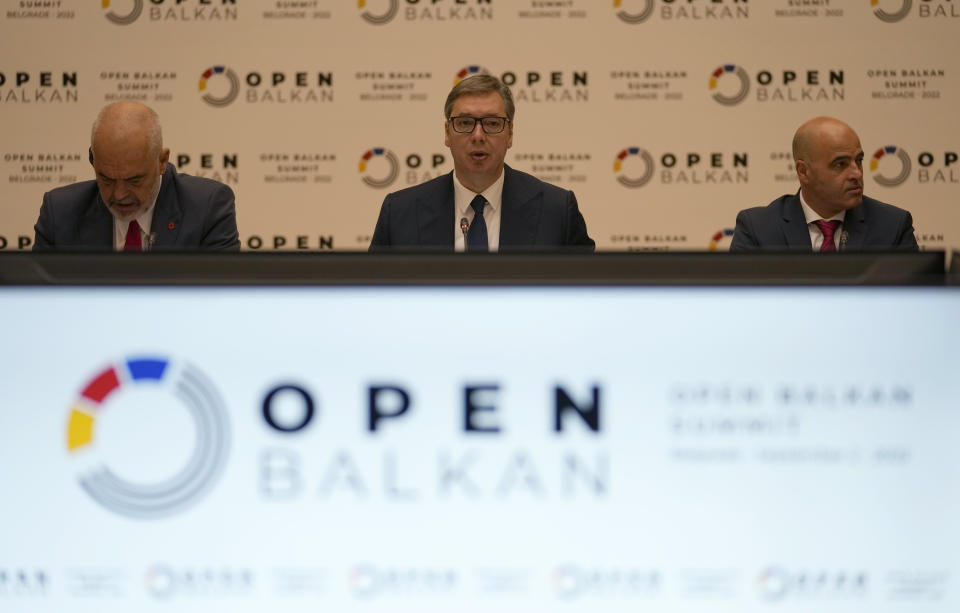 Serbian President Aleksandar Vucic, center, speaks during the "Open Balkan" economic forum for regional cooperation in Belgrade, Serbia, Friday, Sept. 2, 2022. (AP Photo/Darko Vojinovic)