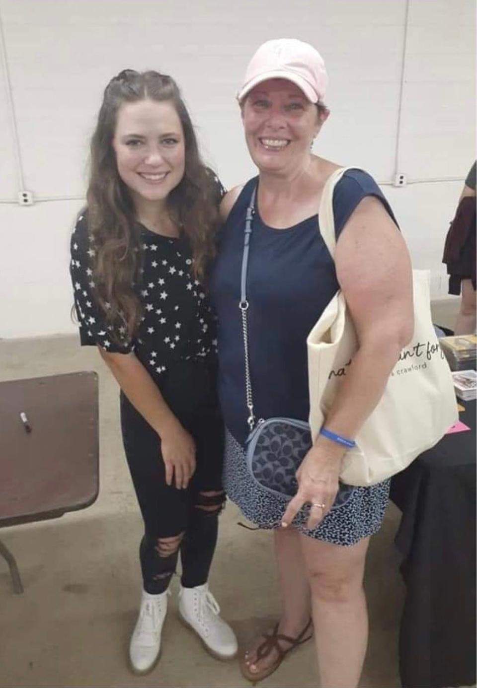 Tina Fronheiser, right, is shown with a musical artist at the Uprise Festival in Pennsylvania last year. Fronheiser is attending this week's Alive Music Festival in the Mineral City area.