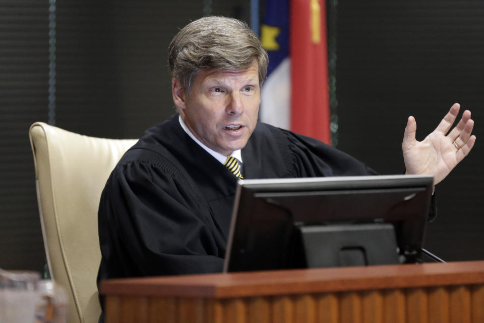 The honorable Paul C. Ridgeway makes comments as a three-judge panel of the Wake County Superior Court presides over the trial of Common Cause, et al v. Lewis, et al at the Campbell University School of Law in Raleigh, N.C., Monday, July 15, 2019. The trial begins Monday in a lawsuit challenging North Carolina legislative districts on the basis that the boundaries were excessively partisan in aiding Republican candidates. The partisan gerrymandering case continued despite a U.S. Supreme Court ruling last month that declared such matters are not the purview of federal courts. (AP Photo/Gerry Broome)