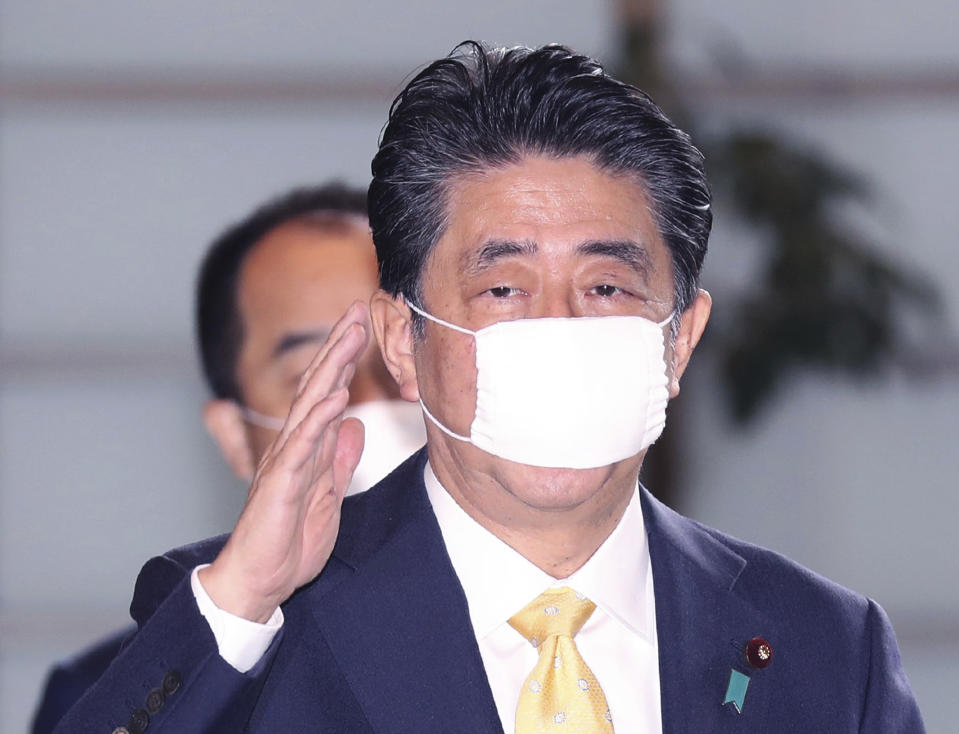 <p>Japan’s Prime Minister Shinzo Abe wearing a face mask (abenomask) arrives at Prime Minister’s office in Tokyo on May 22, 2020. ( The Yomiuri Shimbun via AP Images )</p> 