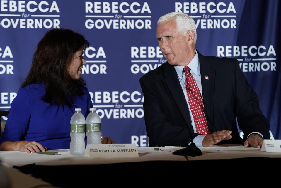 Former Vice President Mike Pence and Wisconsin Rebublican gubernatorial candidate Rebecca Kleefisch participate in a round table discussion Wednesday, Aug. 3, 2022, in Pewaukee, Wis. (AP Photo/Morry Gash)