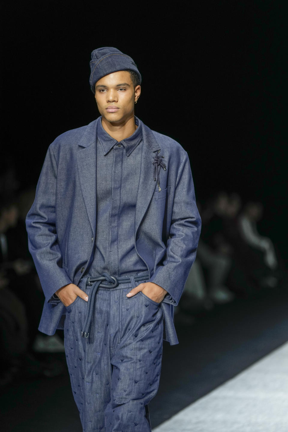 A model wears a creation as part of the men's Giorgio Armani Fall-Winter 2024-2025 collection, that was presented in Milan, Italy, Saturday, Jan. 13, 2024. (AP Photo/Luca Bruno).