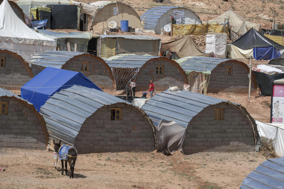 Makeshift homes for people who have been displaced by the earthquake, in Douzrou, near Marrakech, Thursday, April 4, 2024. (AP Photo)