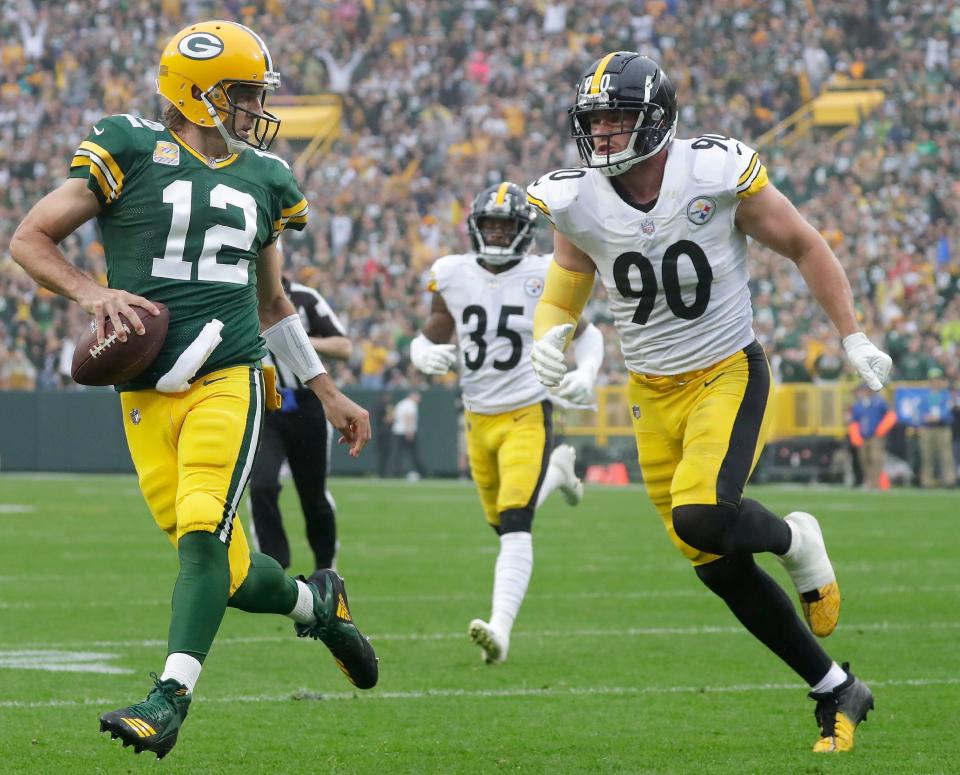 Packers QB Aaron Rodgers and Steelers OLB T.J. Watt (90) might yet reach the playoffs.