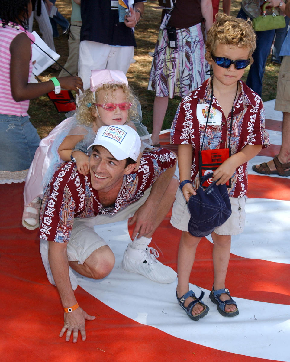 Luke Perry is seen with his daughter Sophie and son Jack at a pediatric AIDS benefit in 2004. Sophie Perry, now 18, has named a preschool in Malawi after him. (Gregg DeGuire via Getty Images)