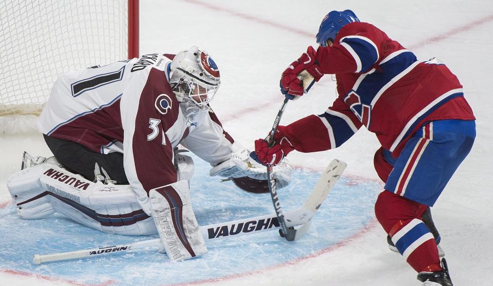 Montreal Canadiens' Torrey Mitchell moves in on Colorado Avalanche goaltender Calvin Pickard during the third period of an NHL hockey game in Montreal, Saturday, Dec. 10, 2016. (Graham Hughes/The Canadian Press via AP)