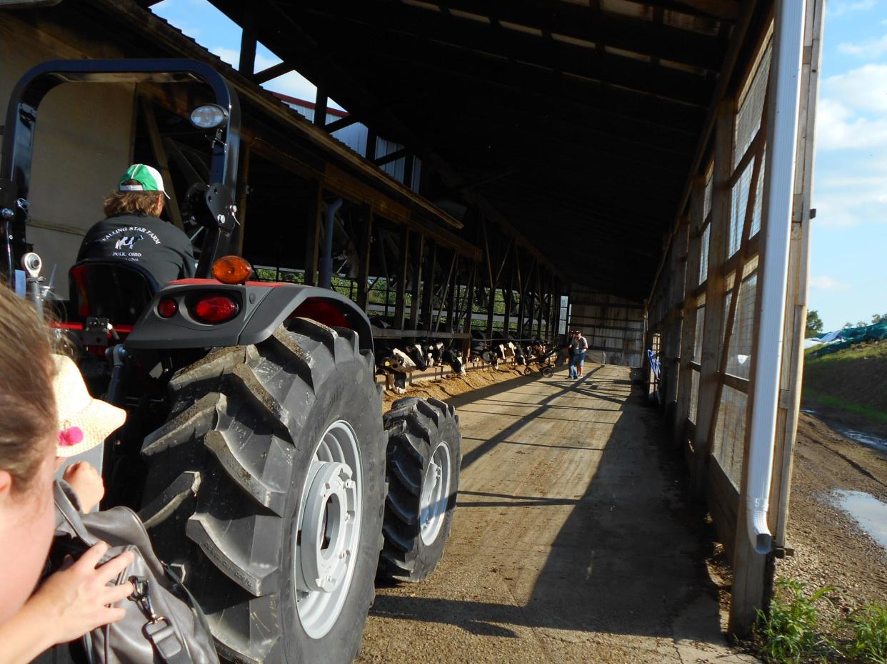 Dairy Twilight Tour attendees travel via a shuttle to view the dairy operation.