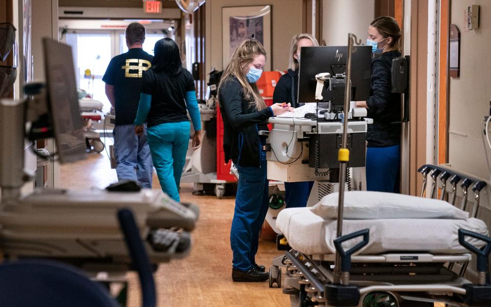 Overflow beds line the hallways in the emergency room at St. Joseph Mercy Oakland Hospital in Pontiac Monday, Jan. 24, 2022. 