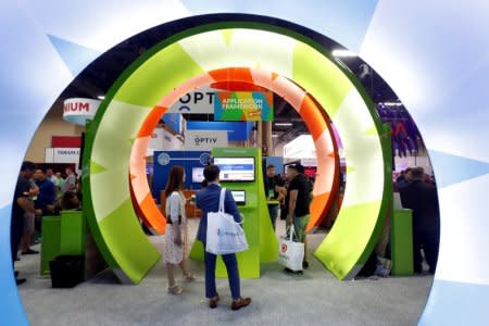 FILE PHOTO: Attendees look over displays from cyber security companies during the Black Hat information security conference in Las Vegas, Nevada, U.S. on July 26, 2017. REUTERS/Steve Marcus/File Photo