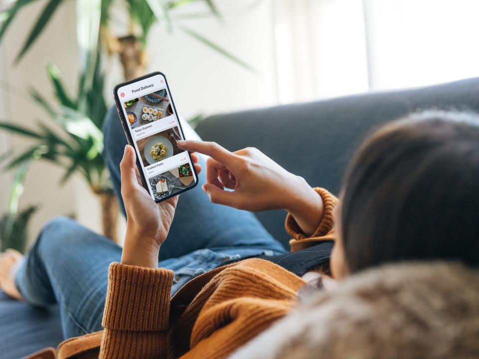 Ordering food cell phone on couch