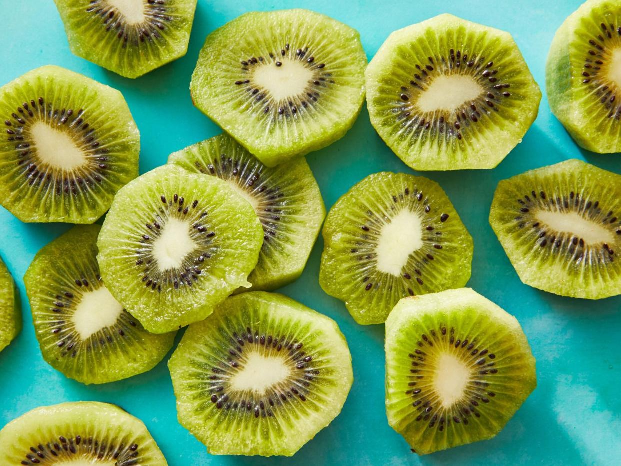 several kiwi rounds on a teal background