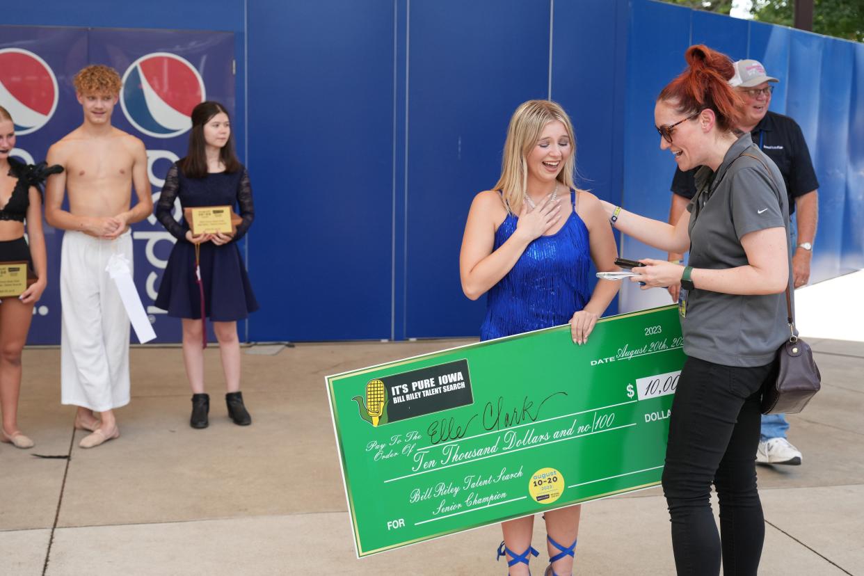 Courtney Crowder, the Register's Iowa Columnist, congratulates Elle Clark after she won the Bill Riley Talent Show.